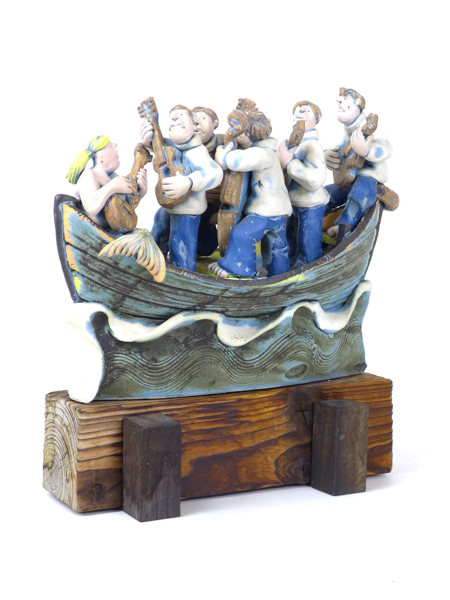 A Studio Pottery figural group, modelled as fishermen serenading a mermaid with guitars, in a boat