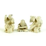 A group of three Japanese ivory katabori netsuke, Meiji period, comprising a pair of vendors, one