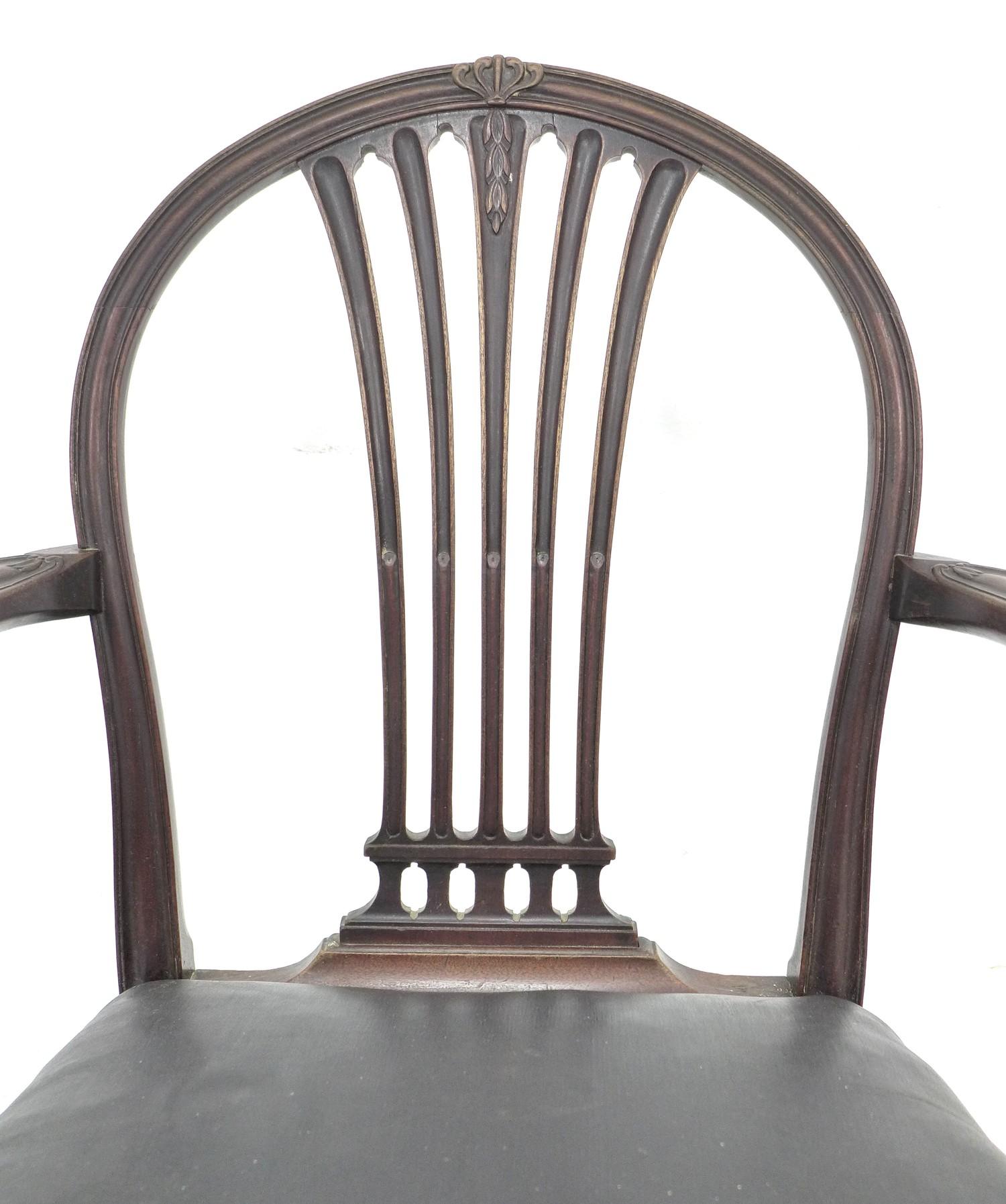 A group of three Georgian mahogany dining chairs, comprising a Hepplewhite style carver with black - Image 2 of 5
