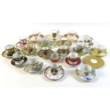 A group of seventeen coffee cups and saucers, together with an Elizabeth II commemorative trio, a