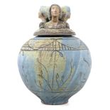 A large and impressive studio pottery jar and cover of ovoid form, the lid modelled as three women