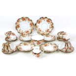A 19th century porcelain part tea service, decorated with Indianische Blumen in ironstone red,