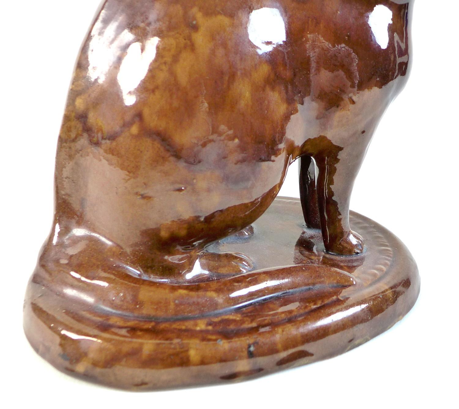 A rare treacle glazed pottery figure, mid to late 19th century, probably Canney Hill Pottery, Bishop - Image 6 of 10