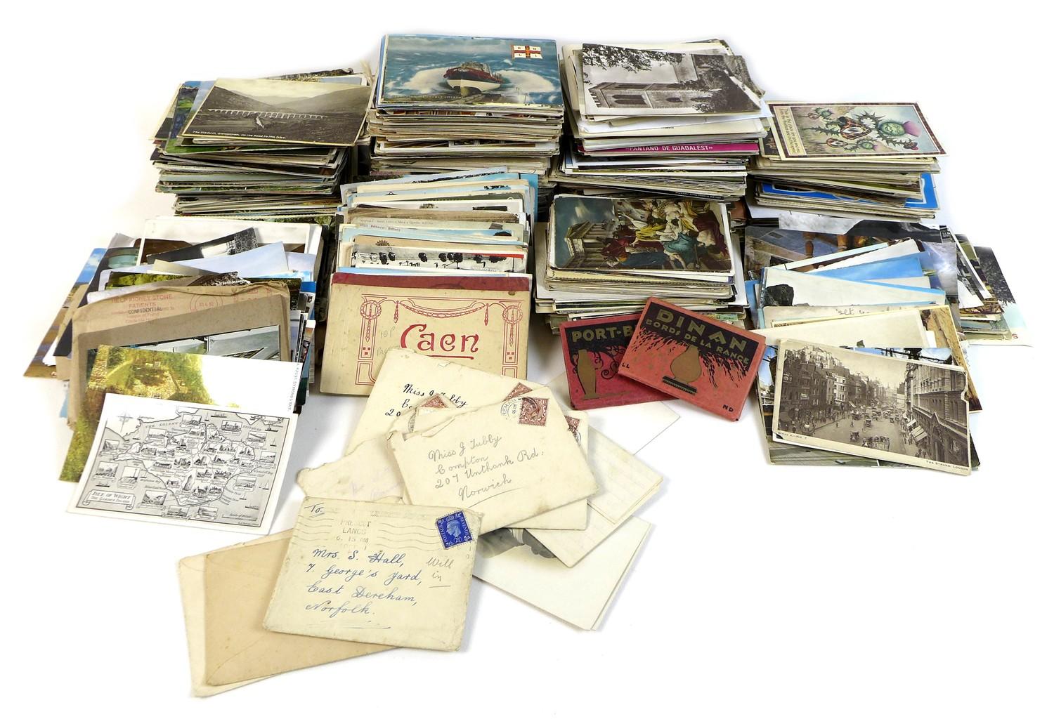 A collection of postcards, mostly Edwardian and later, including some sweetheart cards, envelopes,