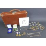 A collection of coins and collectables, including an Irish silver brooch and one other smaller