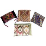 A group of four Kilim and woven fabric cushions, various designs, largest by cm. (4)