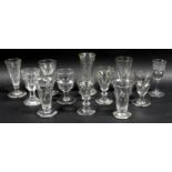 A small collection of clear glass drinking glasses, mostly Victorian and later, including dwarf