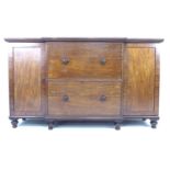 An early Victorian mahogany sideboard chest, of unusual form with two very deep central drawers with