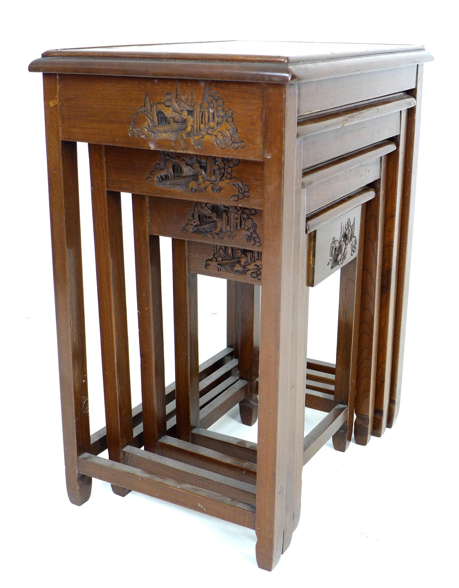A Chinese hardwood nest of four tables, carved decoration, glass tops, largest 51 by 35 by 64cm - Image 2 of 4