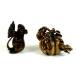 Two Japanese boxwood netsuke, Meiji period, one modelled as two mice eating a pumpkin, with one