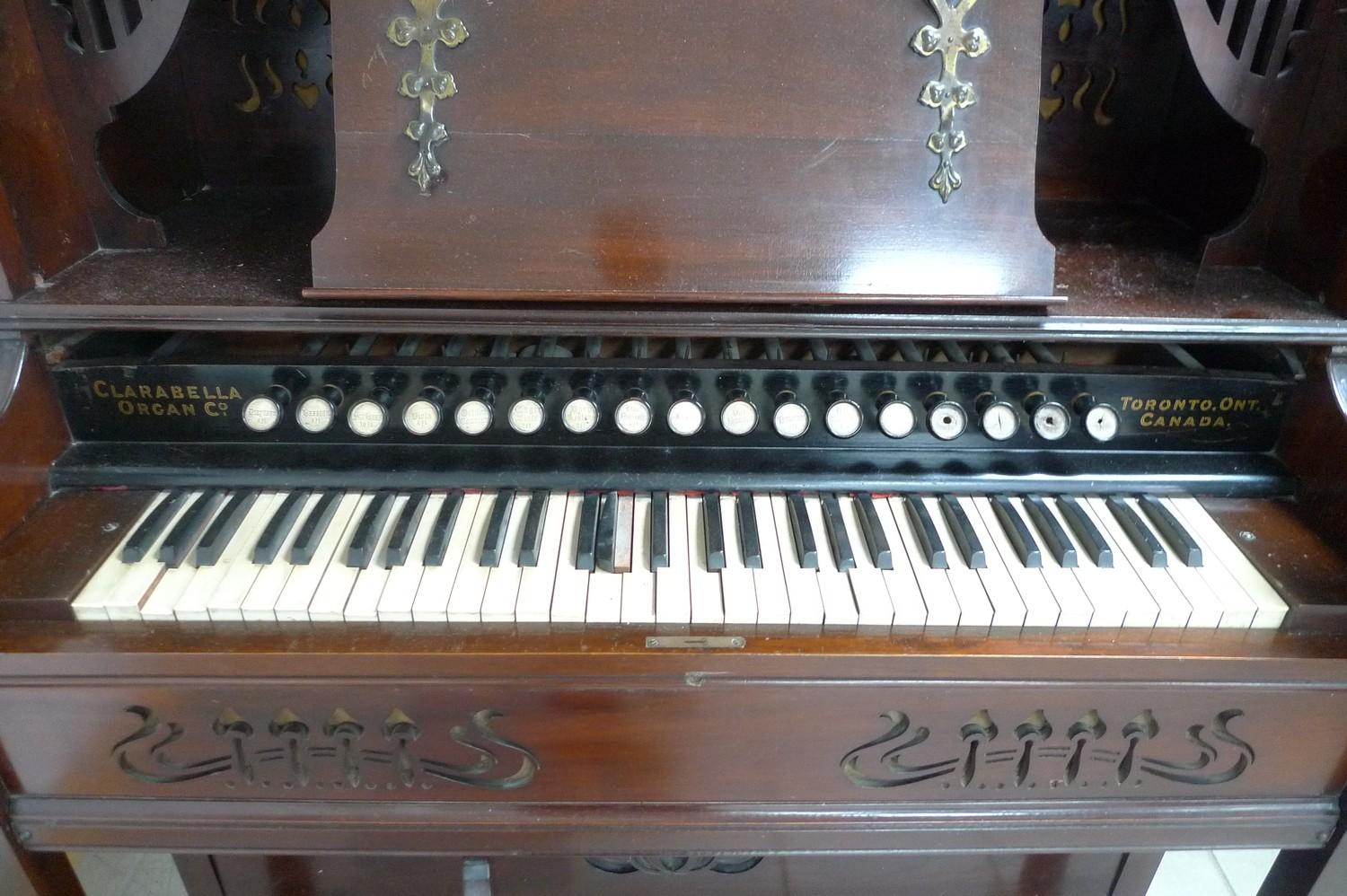 A late 19th century Canadian Clarabella harmonium, with mahogany case, a square form stained glass - Image 2 of 2