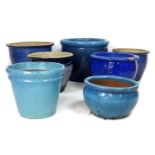 A group of seven modern garden planters, blue and turquoise glazes, largest 49.5 by 41cm high,