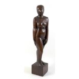 A carved wooden figural sculpture, possibly German, early 20th century, modelled as a standing