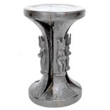 An African wooden stool, carved from a single piece with circular dished top, waisted column with