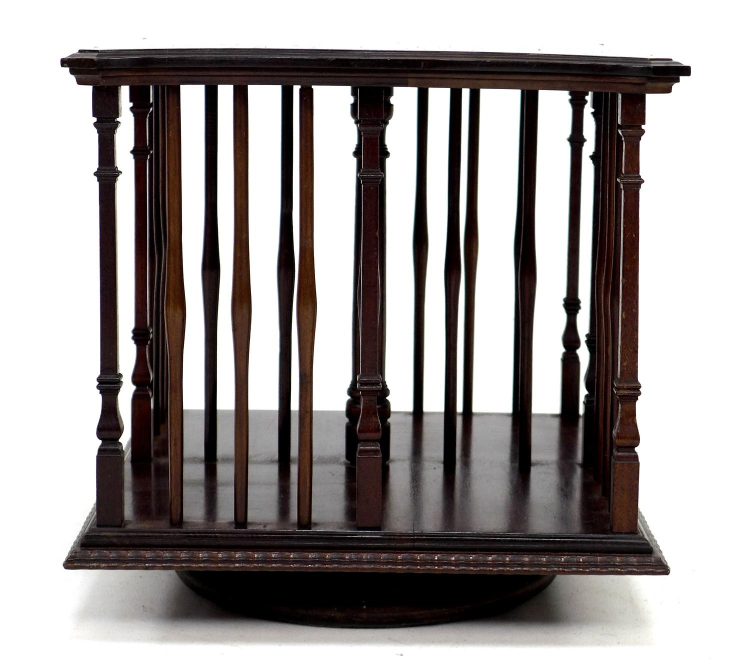 An Edwardian mahogany revolving bookcase, with turned supports, 33 by 33 by 33cm high. - Image 2 of 4