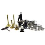 A group of metalware, including a pair of brass candlesticks, a brass ejector candlestick, a