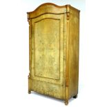 A 19th century mahogany veneered wardrobe, single arched door enclosing a hanging space, raised on