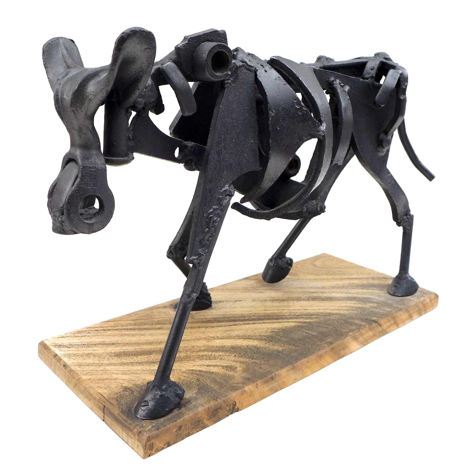 A modernist metal sculpture of a cow, constructed from mechanical parts and scrap on a simple wooden - Image 2 of 5