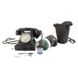 A group of collectables comprising a gas mask in case, a black vintage dial telephone with drawer