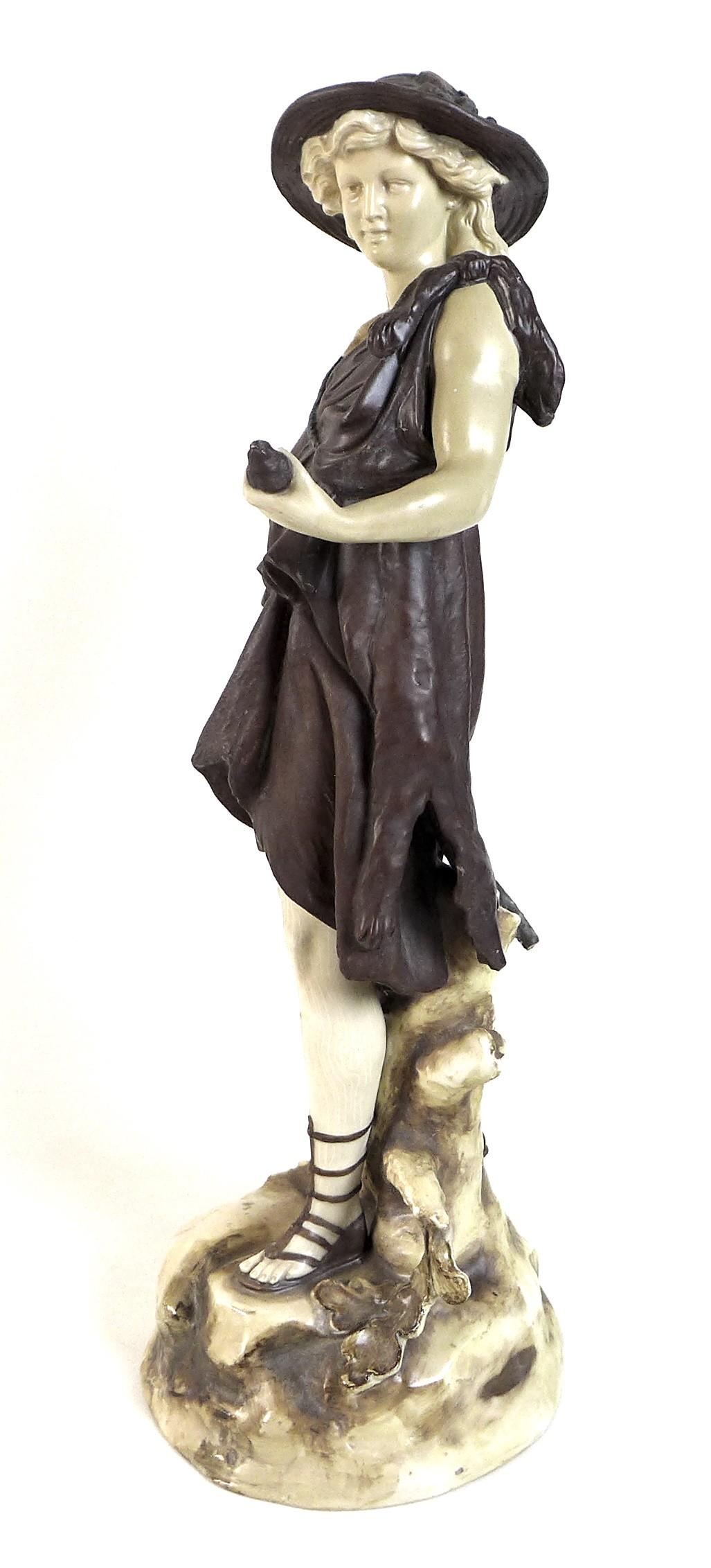 A Rudolstadt ivory porcelain figurine, modelled as a male dressed in a bear skin and carrying a - Image 2 of 4