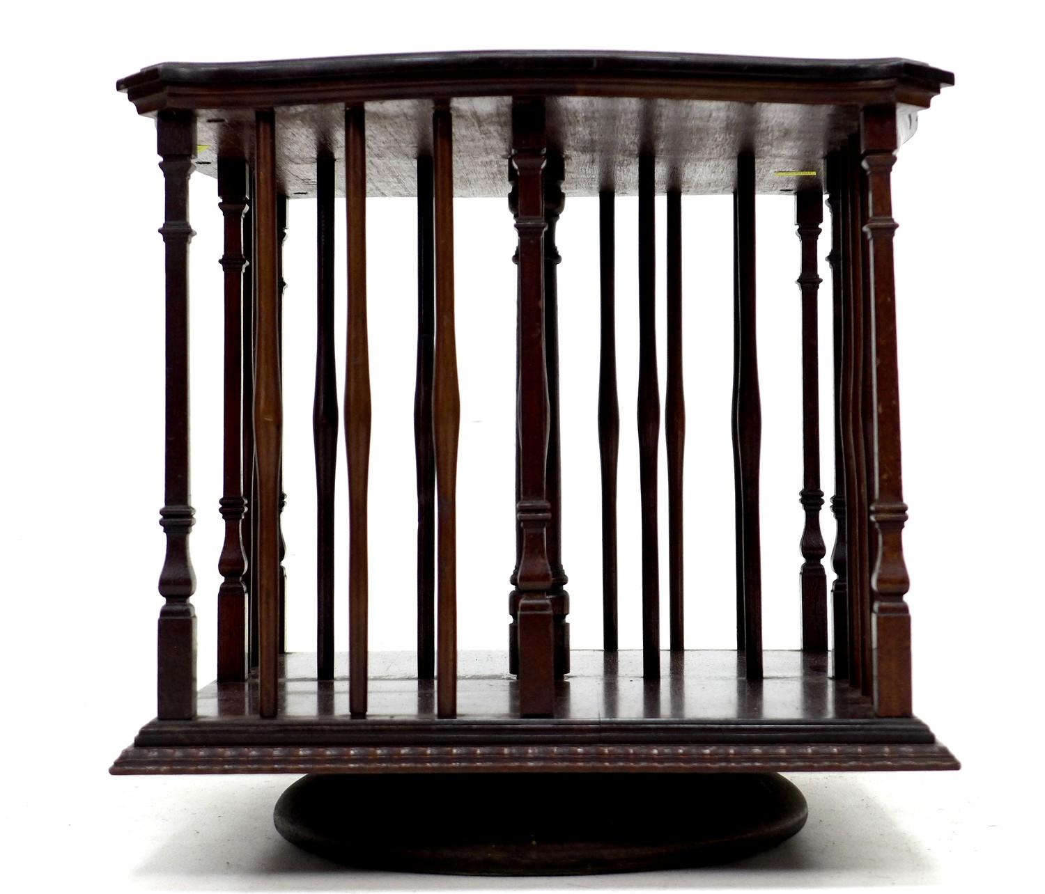 An Edwardian mahogany revolving bookcase, with turned supports, 33 by 33 by 33cm high. - Image 3 of 4