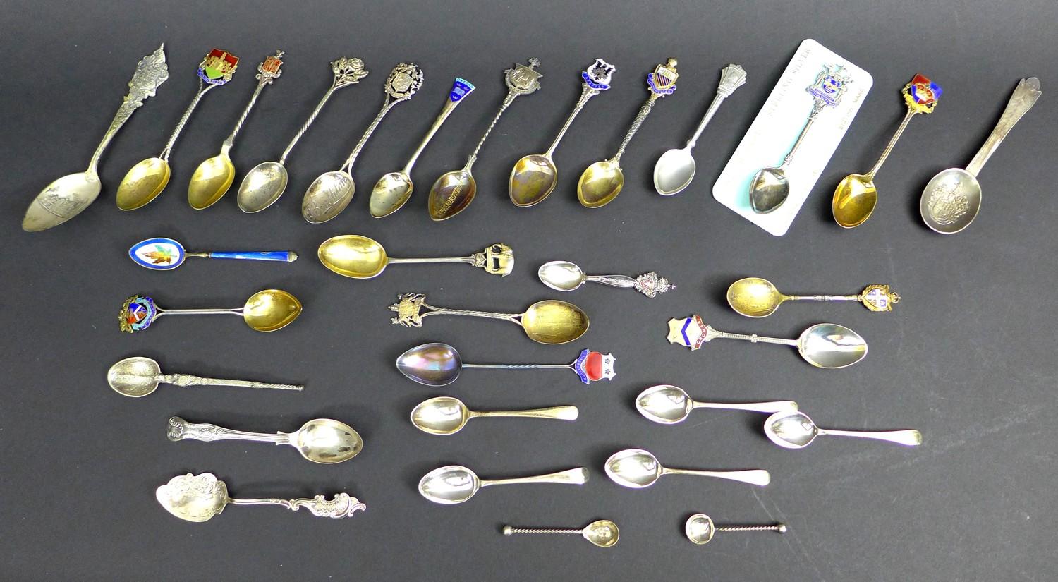 A collection of thirty predominantly 20th century British silver commemorative teaspoons,