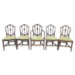 A set of five reproduction Georgian style mahogany dining chairs, with shield shaped carved and