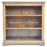 A good quality oak reproduction bookcase, in Georgian style, freestanding with closed back, the