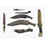 A group of knives, comprising three Kukris, largest with 34cm blade, 44cm overall, a GMR, number