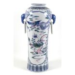A modern Chinese porcelain vase, of tall slender form, decorated with panels depicting a dragon