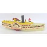 A cast iron push toy model Mississippi paddle steamer, 38 by 8.5 by 13cm high.
