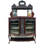 A high Victorian display sideboard cabinet, with shaped mirror back with carved crest rail above,