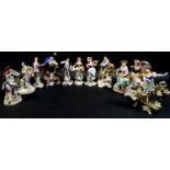 A group of eleven Sitzendorf porcelain figures, all in 18th century style and costume, comprising