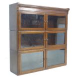 A mid 20th century Minty oak sectional bookcase, the three sections with hinged twin doors, 89.5