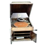 An Edwardian His Master Voice oak cased gramophone, caddy form lift lid opening to reveal the