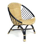 A retro wicker and bentwood armchair, with black painted frame and wicker bound joints, 77 by 64