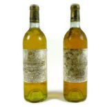 Two bottles of Chateau Coutet a Barsac, Premier Cru Classe, 1985, U: both base neck. (2) Kept by