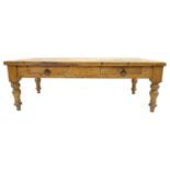 A large late Victorian pine kitchen table, the solid 2" thick rectangular surface over two drawers