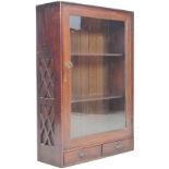 A late Victorian mahogany display case, single glazed door enclosing two fixed shelves, two small