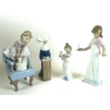 A group of two Lladro and two Nao figurines comprising Lladro: 'Purr-fect Friends', number 6512,