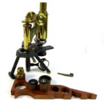 A late Victorian brass compound microscope, J. Swift & Son, London, in fitted mahogany case, with