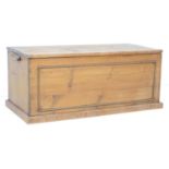 A Victorian pine and oak blanket chest, with oak lift lid, the single front panel with decorative