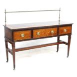 A Regency mahogany and inlaid sideboard, with brass pole upstand, three frieze drawers with oval