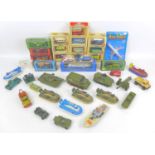 A collection of Dinky Toys army vehicles and and other die-cast toy vehicles, including Dinky Toys