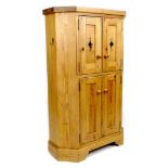 A modern pine corner cabinet, by Shortland, Fine Handcrafted Interiors, the twin doors with