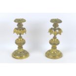 A pair of 19th century Continental gilt metal candlesticks, each 10 by 22cm high. (2)