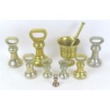 A group of eight 19th century brass bell weights, some made by Avery, 7lb and smaller, together with