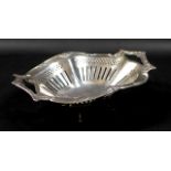 An Edward VII twin handled silver bowl, pierced wheel and column detailing to body, applied