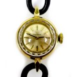 An Omega 18K gold cased lady's wristwatch, circa 1965, the circular gold dial with gold and black
