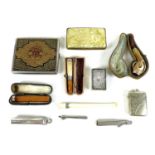 A selection of tobacciana including an amber cheroot holder with 9ct rose gold collar, cased, a